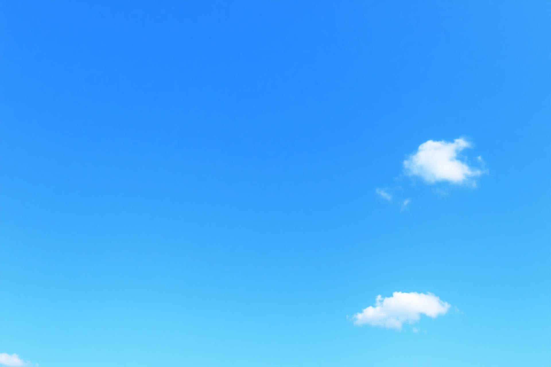 Sky blue background with white clouds
